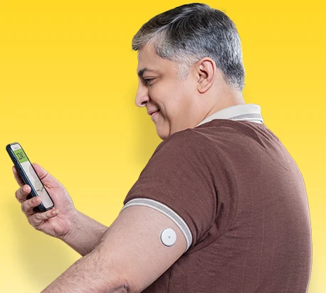 Man checking his glucose readings on his phone